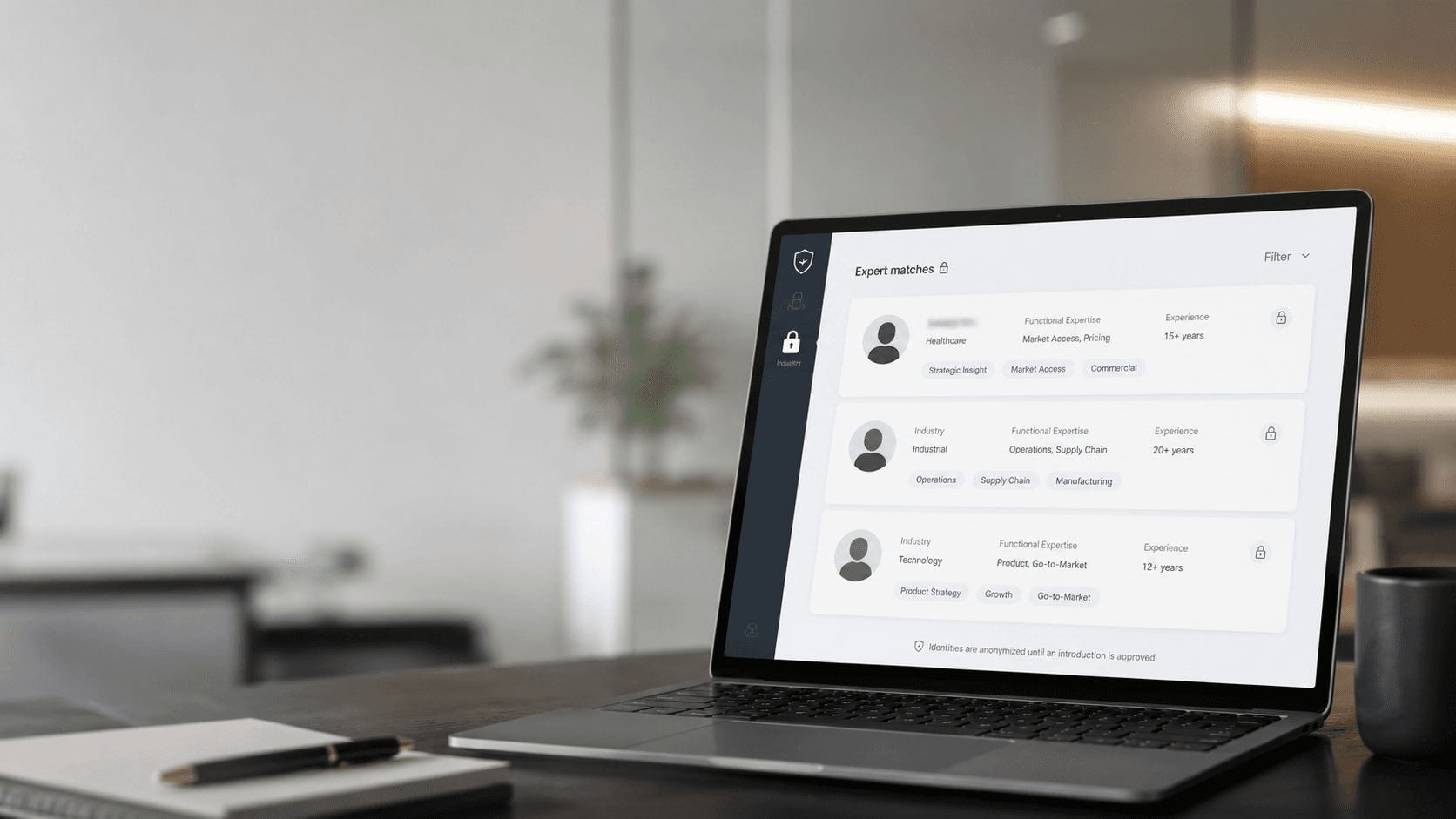 Laptop displaying an expert matching platform with anonymized professional profiles in a modern office setting.